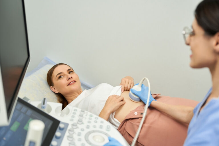 Medical professional conducting reproductive health diagnostics for a patient in clinic