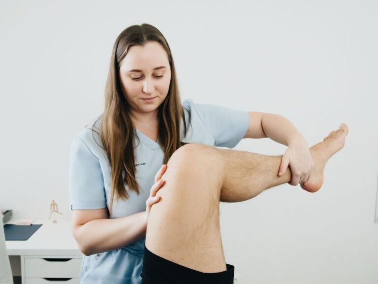 Clinician examining a patient's foot and ankle